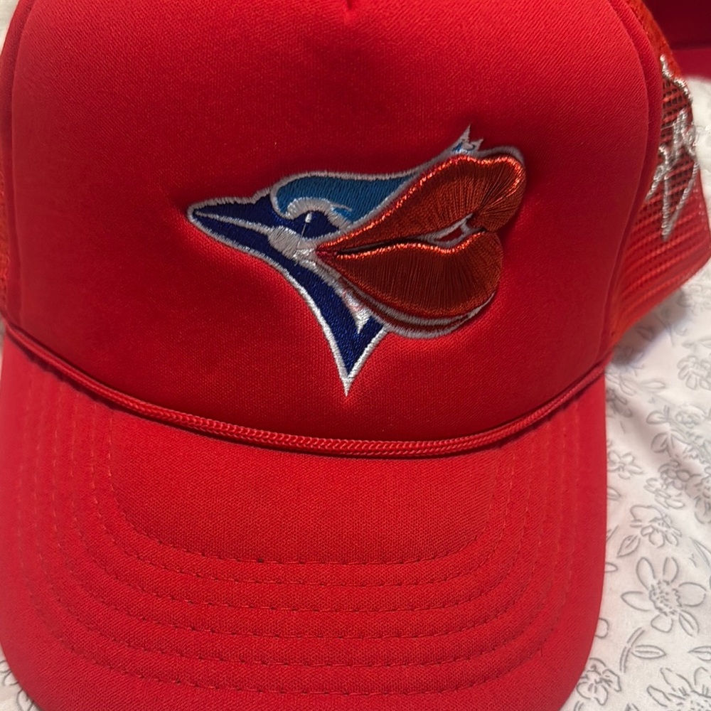 Red Cap with Embroidered Bird Design